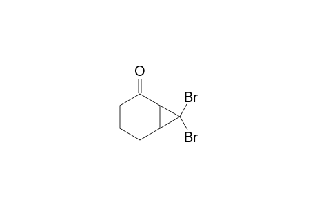 7,7-dibromobicyclo[4.1.0]heptan-5-one