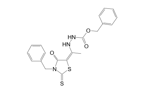 Benzyl 2-[(1E)-1-(3-benzyl-4-oxo-2-thioxo-1,3-thiazolidin-5-ylidene)ethyl]hydrazinecarboxylate