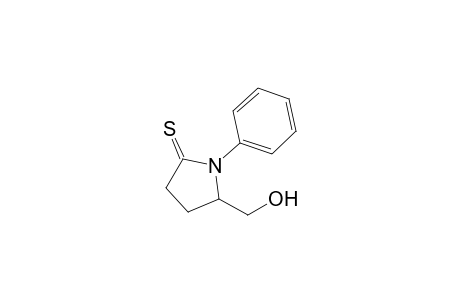 5-(hydroxymethyl)-1-phenyl-2-pyrrolidinethione