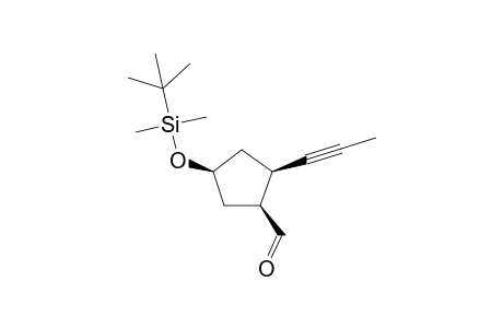 (1S,2R,4S)-4-[(tert-Butyldimethylsilyl)oxy]-2-(prop-1-yn-1-yl)cyclopentane-1-carbaldehyde