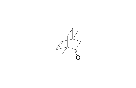Bicyclo[2.2.2]oct-5-en-2-one, 1,4-dimethyl-, (.+-.)-