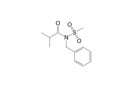 N-Benzyl-N-(2-methylpropanoyl)methanesulfonamide