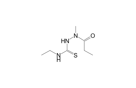 Propanoic acid, 2-[(ethylamino)thioxomethyl]-1-methylhydrazide