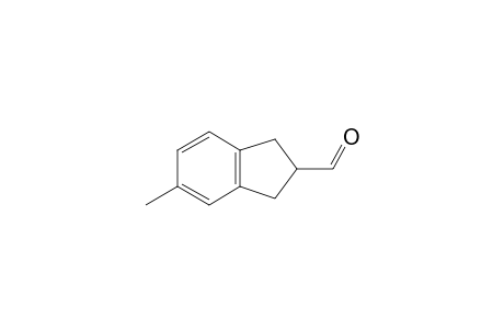 2,3-Dihydro-5-methyl-1H-indene-2-carboxaldehyde