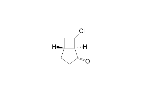 Bicyclo[3.2.0]heptan-2-one, 7-chloro-, trans-