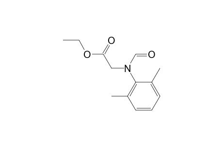 Glycine, N-(2,6-dimethylphenyl)-N-formyl-, ethyl ester