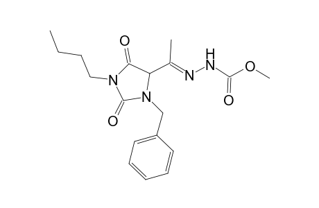 Methyl 2-[1-(3-benzyl-1-butyl-2,5-dioxoimidazolidin-4-yl)ethylidene]hydrazinecarboxylate