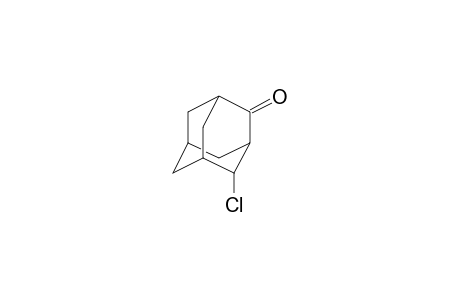 2-Adamantanone, 4-chloro-, (1S,4R)-