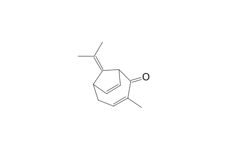 Bicyclo[4.2.1]nona-3,7-dien-2-one, 3-methyl-9-(1-methylethylidene)-