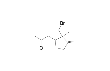 2-Propanone, 1-[2-(bromomethyl)-2-methyl-3-methylenecyclopentyl]-, (1R-trans)-