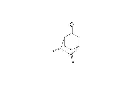 Bicyclo[2.2.2]octanone, 5,6-bis(methylene)-