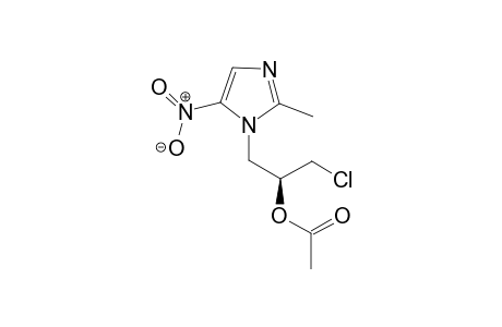 (-)-(S)-1-chloro-3-(2-methyl-5-nitro-1H-imidazol-1-yl)propan-2-yl acetate