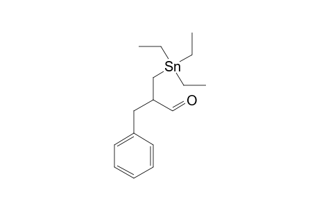 2-Benzyl-3-(triethylstannyl)propanal