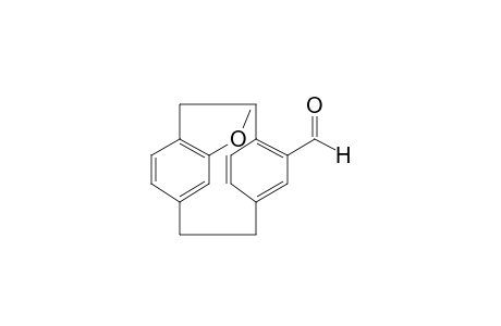 13-Methoxytricyclo[8.2.2.24,7]hexadeca-1(13),4,6,10(14),11,15-hexaene-5-carbaldehyde