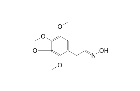 1,3-Benzodioxole-5-acetaldehyde, 4,7-dimethoxy-, oxime