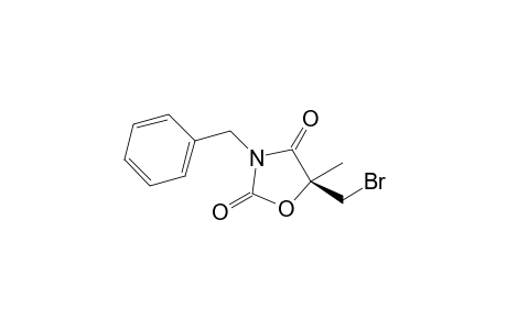 (5S)-N-Benzyl-5-(bromomethyl)-5-methyloxazolidine-2,4-dione