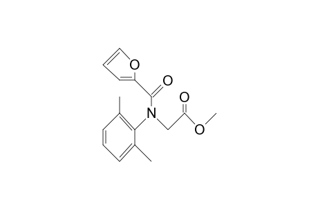 Glycine, N-(2,6-dimethylphenyl)-N-(2-furanylcarbonyl)-, methyl ester