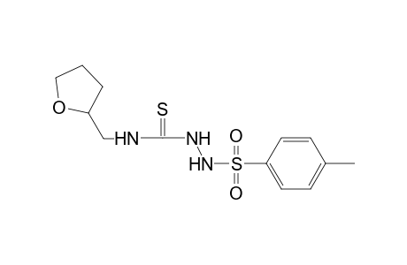 2-[(4-methylphenyl)sulfonyl]-N-(tetrahydro-2-furanylmethyl)hydrazinecarbothioamide