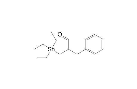 2-Benzyl-3-(triethylstannyl)propanal